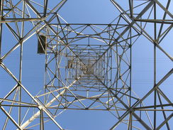 P20113243524	Looking up a pylon carrying cables over the river.