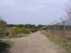 P20113283857	The path beside the fence of RAF Woodbridge.