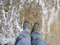 P20114084501	Washing my boots in the sea.