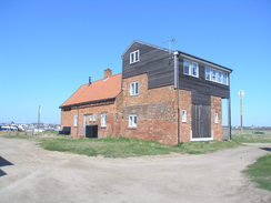 P20114084557	Riverside buildings in Walberswick.