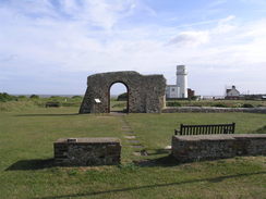 P20115235870	The remains of St Edmund's Chapel, with the lighthouse behind.