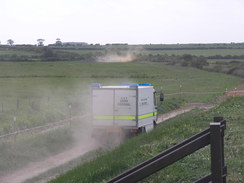 P20115236033	An RAF bomb disposal vehicle leaving the marshes.