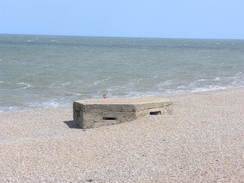 P20115246289	A pillbox buried in the shingle.