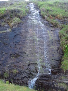 P2011DSC00481	A sheet of water falling down a slab of rock.