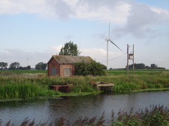 P2011DSC01749	A wind turbine and pumping station.