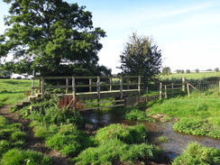 P2011DSC02795	A bridge over a stream near Biscathorpe Church.