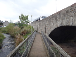 P2011DSC04550	The footbridge over the Burn of Cromdale.