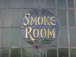 P2011DSC06478	A smoke room sign in the window an old pub on the B1062.