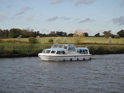 P2011DSC06526	A cruiser heading down the Waveney.