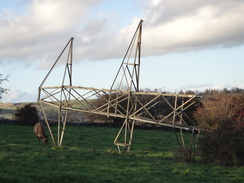 P2011DSC06793	The top of a pylon lying in a field.