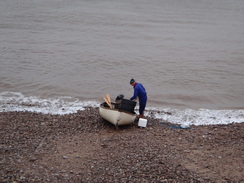 P2011DSC07066	A fisherman landing his boat.