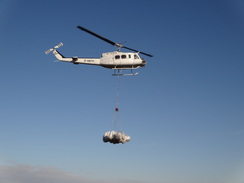 P2011DSC07952	A helicopter dropping off bags of chopped heather.