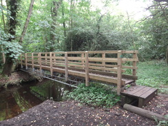 P2012DSC00794	A footbridge over a stream near Flixton Decoy.