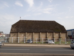 P2012DSC00929	A thatched building by the Haven Bridge.