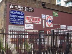 P2012DSC01218	Signs on the end of a building in Vauxhall.