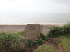 P2012DSC02030	An anti-tank block about to fall down the cliffs.