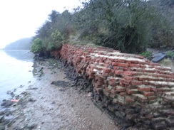 P2013DSC04643	A brick wall of Cockham Wood Fort on the foreshore to the west of Hoo Marina Park.