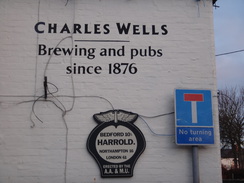 P2018DSC07574	SIgns on a pub wall in Harrold.