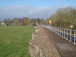 P2018DSC07681	The raised footpath beside the road leading to Harrold Bridge.