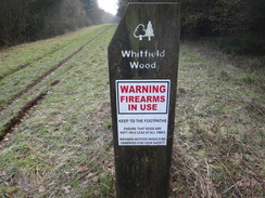 P2018DSC08004	A warning sign by the path through Whitfield Wood.