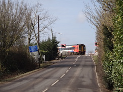 P2018DSC08453	A train crossing a level crossing at Queen Adelaide.