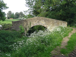 P2018DSC00814	A packhorse bridge leading to Barnwell church.