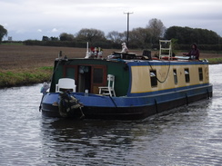 P2019DSCF3480	A canal boat approaching Downholland Cross.