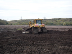 P2019DSCF3893	A bulldozer landscaping an old pit area near Lea Green.