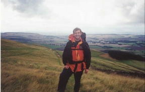 R14	Myself on the descent from Wideopen Hill. In the background is the ground that I would walk over in the next two days.