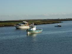 P2002B260079	Boats tied up in Potton Creek near Barling. 