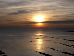 P20082103349	The sun setting over Kimmeridge Bay.