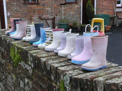 P2010C131163	A line of boots outside a nursery in Shapwick.
