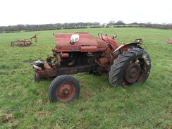 P20111272361	An old tractor in a field.