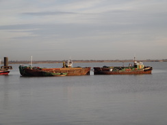 P2013DSC04458	Two barges moored on the river.