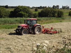 P2018DSC02158	A tractor turning hay.