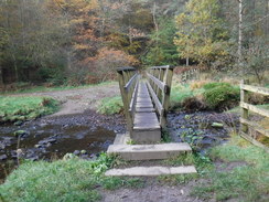 P2019DSCF4122	A footbridge over the stream leading into Turton reservoir.