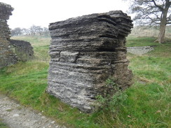 P2019DSCF4142	A stack of strange material beside a ruined building above Cadshaw.